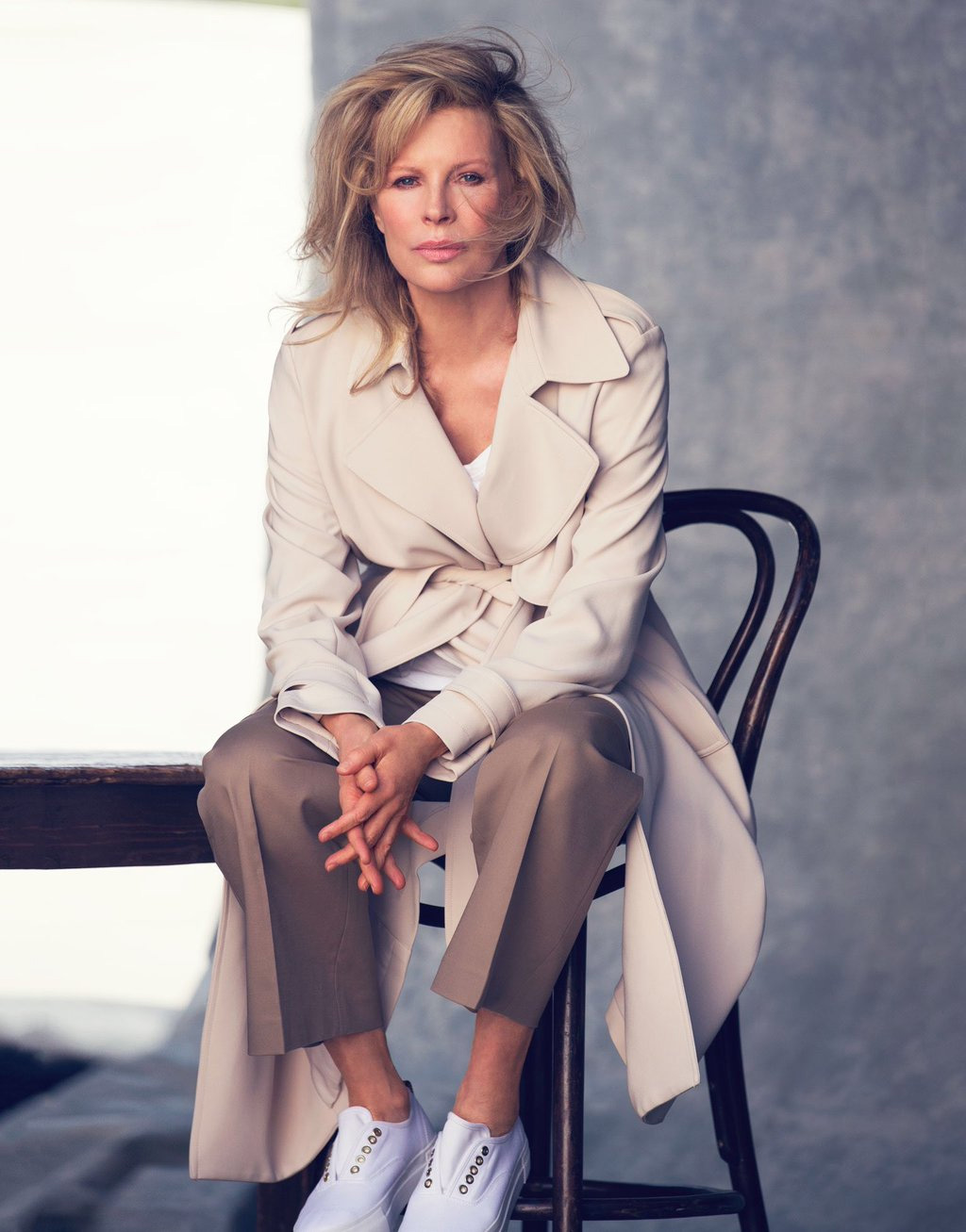 Kim Basinger by David Bellemere. Coat by Theory, pants by The Row, sneakers by Eytys, t-shitrt by James Perse