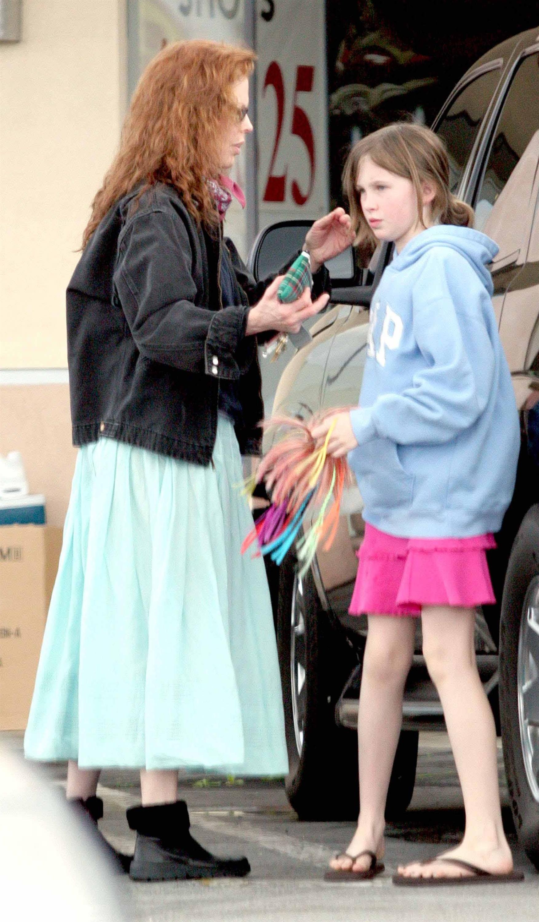 Kim Basinger with red hair and Ireland Baldwin on February 12, 2005 during Even Money shooting