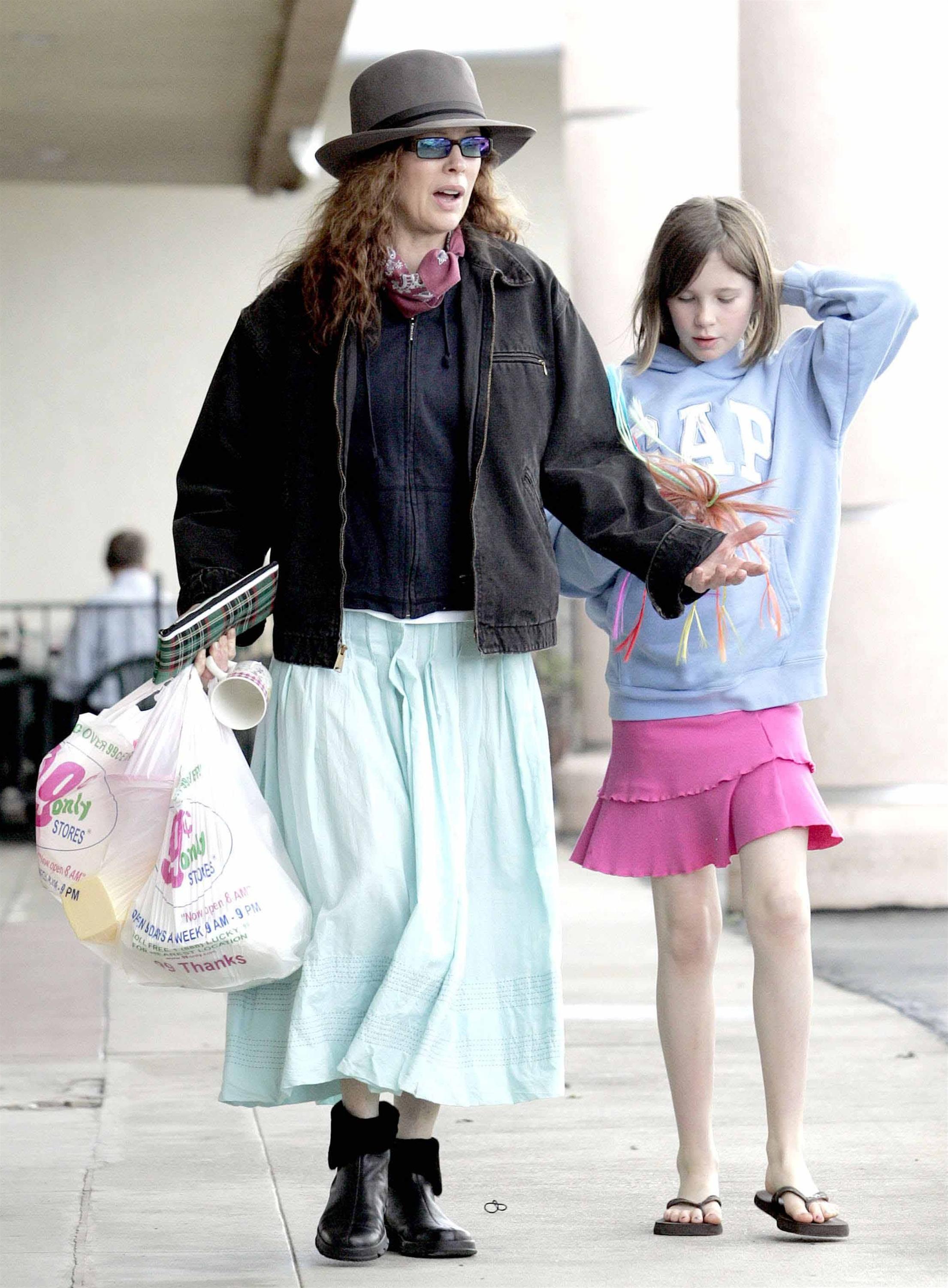 Kim Basinger with red hair and Ireland Baldwin on February 12, 2005 during Even Money shooting